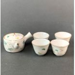 A miniature Chinese porcelain tea set, tea cup 3 x 4cm. Teapot and one cup A/F.