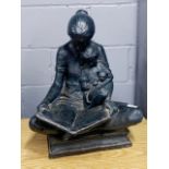 A patinated bronze finished large resin figure of a mother reading to a child, H. 53cm.