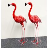 Two painted metal garden flamingo figures, H. 72cm.
