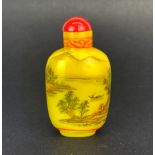 A Chinese painted imperial yellow glass snuff bottle, H. 7cm.