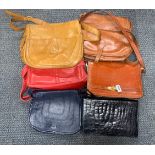 A group of vintage leather bags.