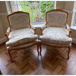 A pair of Queen Anne style cream upholstered armchairs, 61 x 37cm.