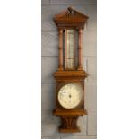 An antique carved oak barometer, H. 101cm.