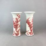A lovely pair of Chinese iron red underglaze decorated porcelain cylinder vases, H. 22cm.