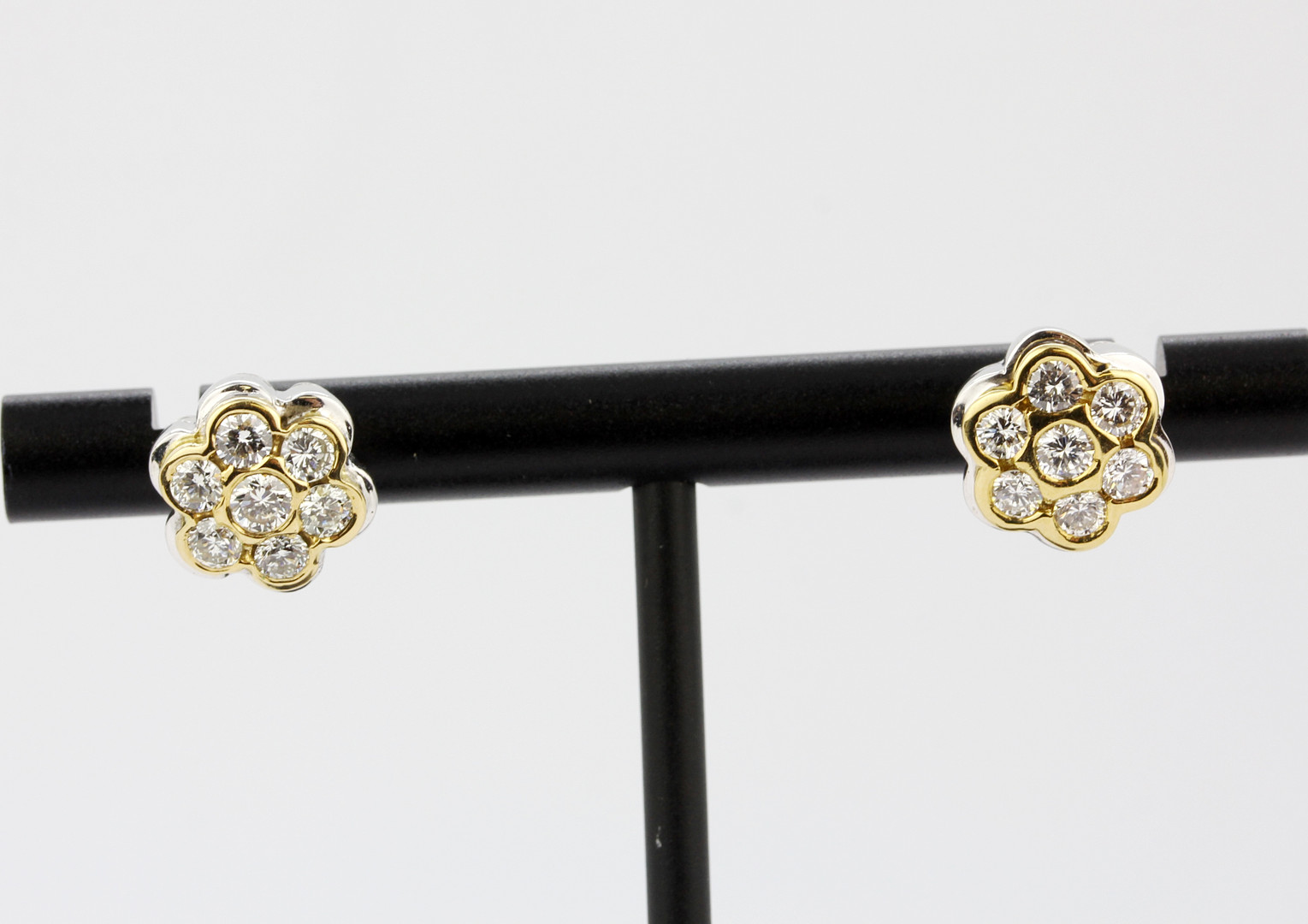A pair of yellow and white metal (tested high carat gold, minimum 18ct) daisy cluster stud - Image 3 of 5