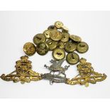 A quantity of military cap badges and buttons.