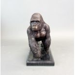 A bronze figure of a gorilla on a marble base, H. 18cm.