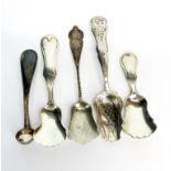 A group of hallmarked and sterling silver caddy spoons.