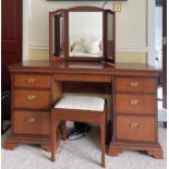 A Stag mahogany mirror backed dressing table with stool, 135 x 134cm.
