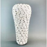 A large complex glazed porcelain vase encrusted with flowers, H. 46cm.