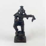 A Himalayan bronze figure of a guardian deity, H. 9cm.