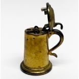 A mid-20th Century Dunhill gilt brass table lighter in the form of a tankard.