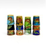 A collection of enamelled thimbles.