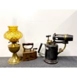 A large brass and iron blow torch, H. 34cm. together with a Victorian cast iron charcoal iron and
