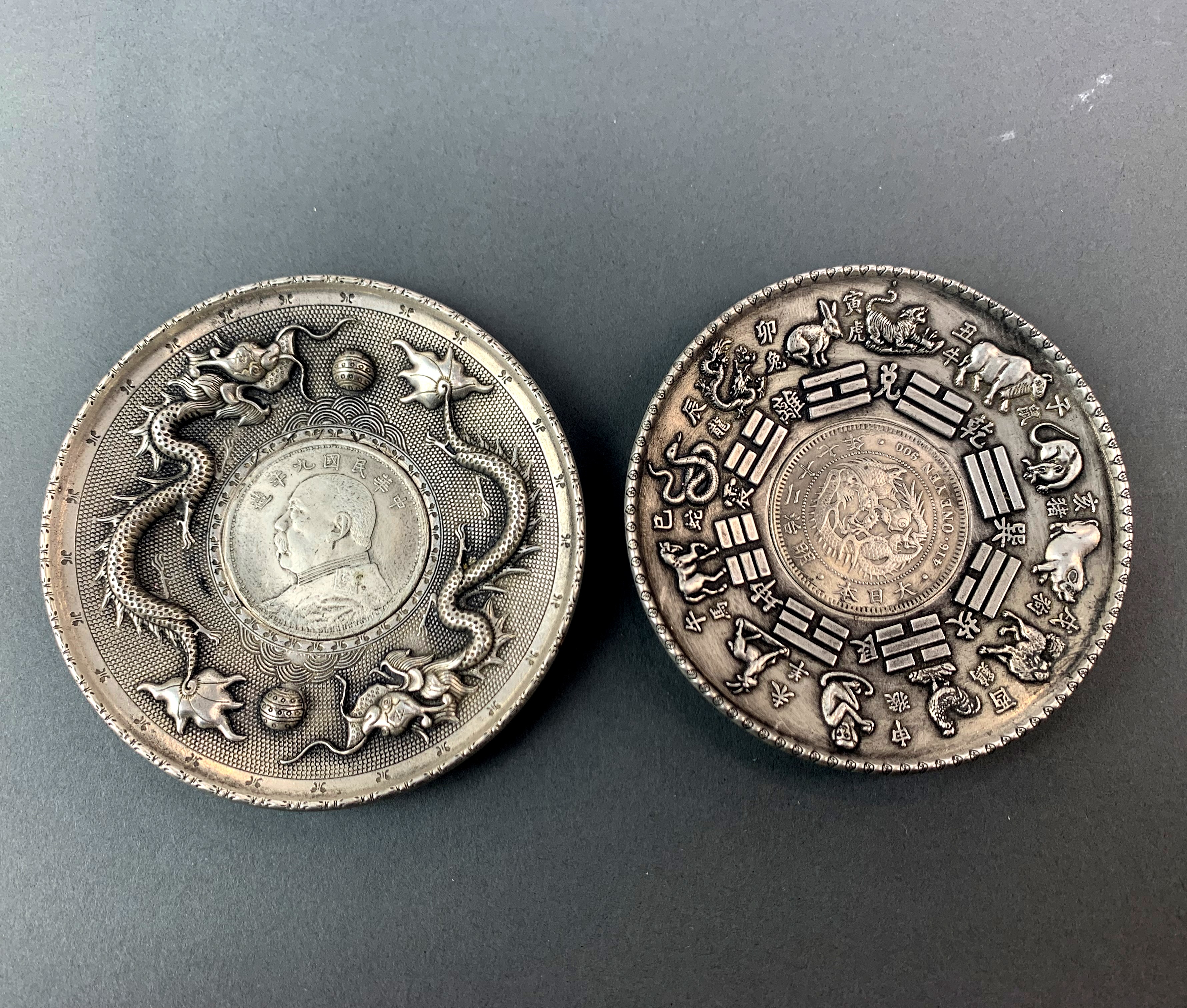 Two Chinese white metal dishes, Dia. 10cm.