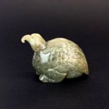 A Chinese carved jade model of a bird, H. 5cm. L. 7cm.