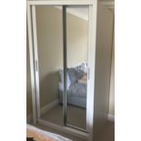 A white painted mirror fronted wardrobe, 215 x 121cm.