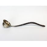 An American sterling silver and wooden handled toddy ladle, L. 35cm.