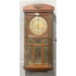 An antique oak wall clock, H. 74cm.