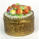 A 19th/early 20th Century French gilt brass and porcelain lined trinket box, Dia. 6cm. D. 5cm.