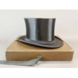 A boxed collapsible opera top hat belonging to Helmut Doerner (a German commander in the Waffer-SS