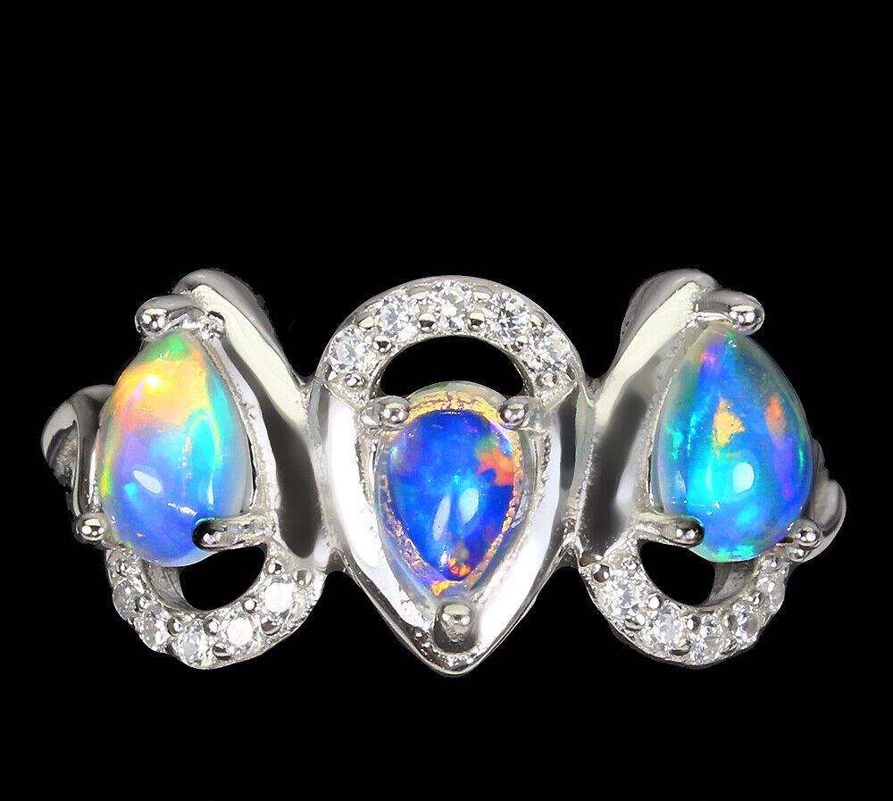 A 925 silver ring set with pear cabochon cut opals and white stones, (N).