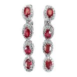 A pair of 925 silver drop earrings set with oval cut rubies and white stones, L. 3.3cm.