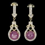 A pair of gold on 925 silver drop earrings set with cabochon cut rubies and white stones, L. 2.9cm.