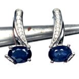 A pair of 925 silver earrings set with oval cut sapphires and white stones, L. 1.8cm.