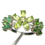 A 925 silver triple flower shaped ring set with emeralds, peridots and chrome diopsides, (N).