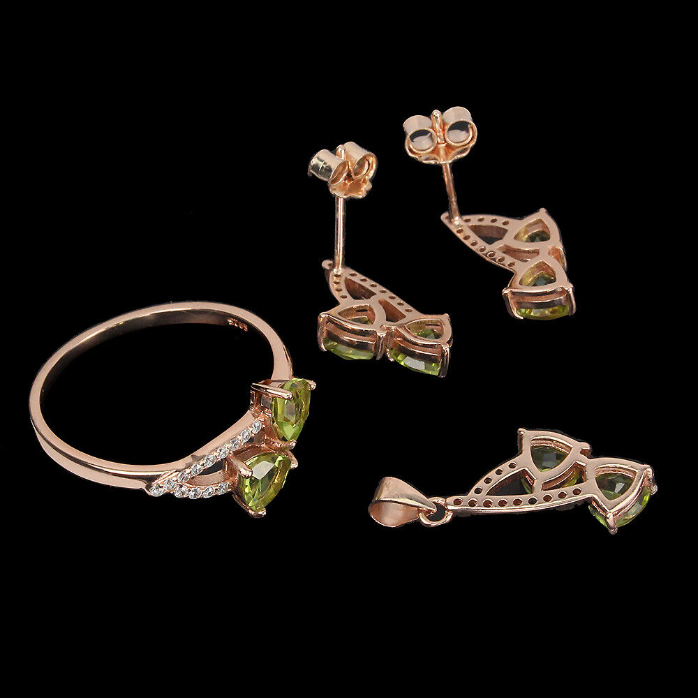 A jewellery suite of rose gold on 925 silver set with trillion cut peridots and white stones, - Image 3 of 3