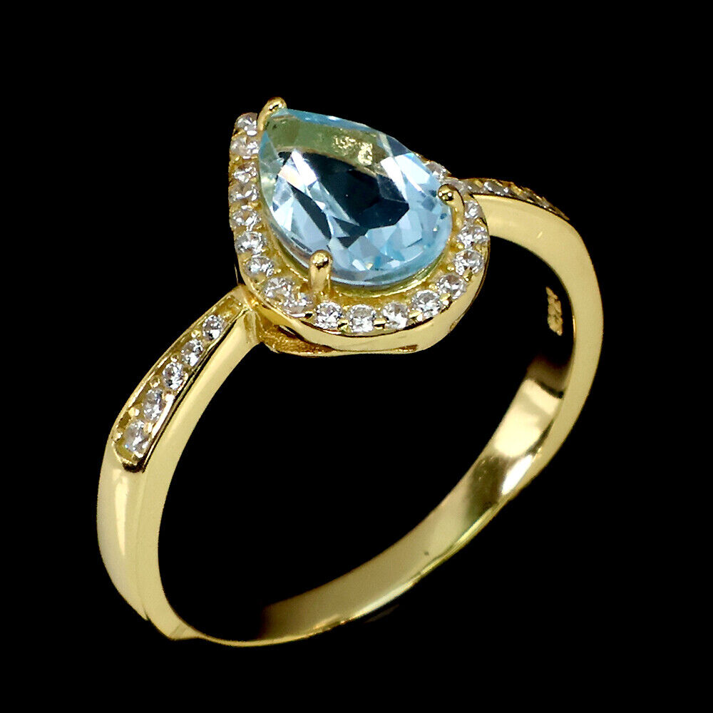 A matching gold on 925 silver ring set with pear cut blue topaz and white stones, (O.5). - Image 2 of 3