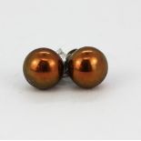 A pair of silver chocolate cultured pearl stud earrings, Dia. 5mm.