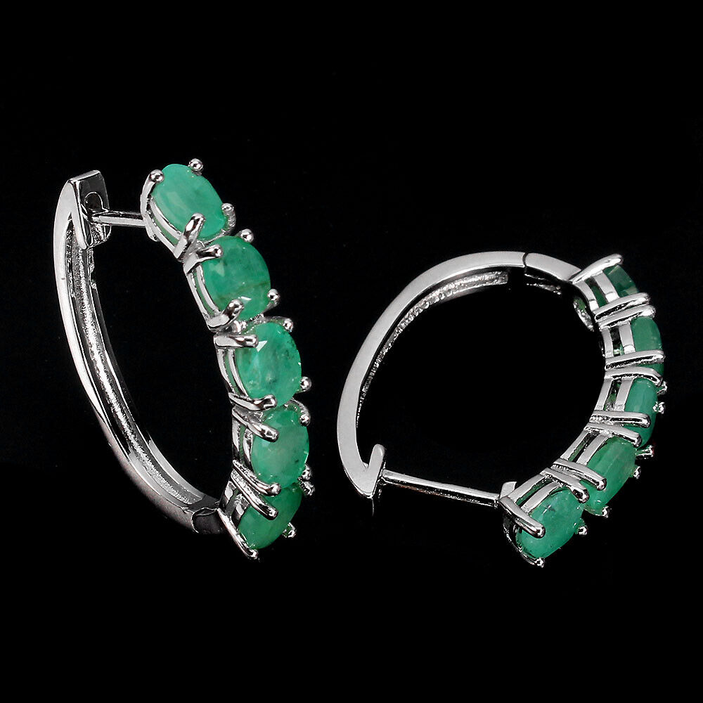 A pair of 925 silver hoop earrings set with oval cut emeralds, L. 2.4cm. - Image 2 of 2