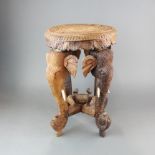 An Indian carved elephant head stool/table, H. 46cm, dia. 31cm.