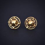 A pair of yellow metal (tested high carat gold, approx. 20ct) stud earrings with marked 22ct
