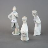 Three early Lladro bisque porcelain figures, tallest 22cm.