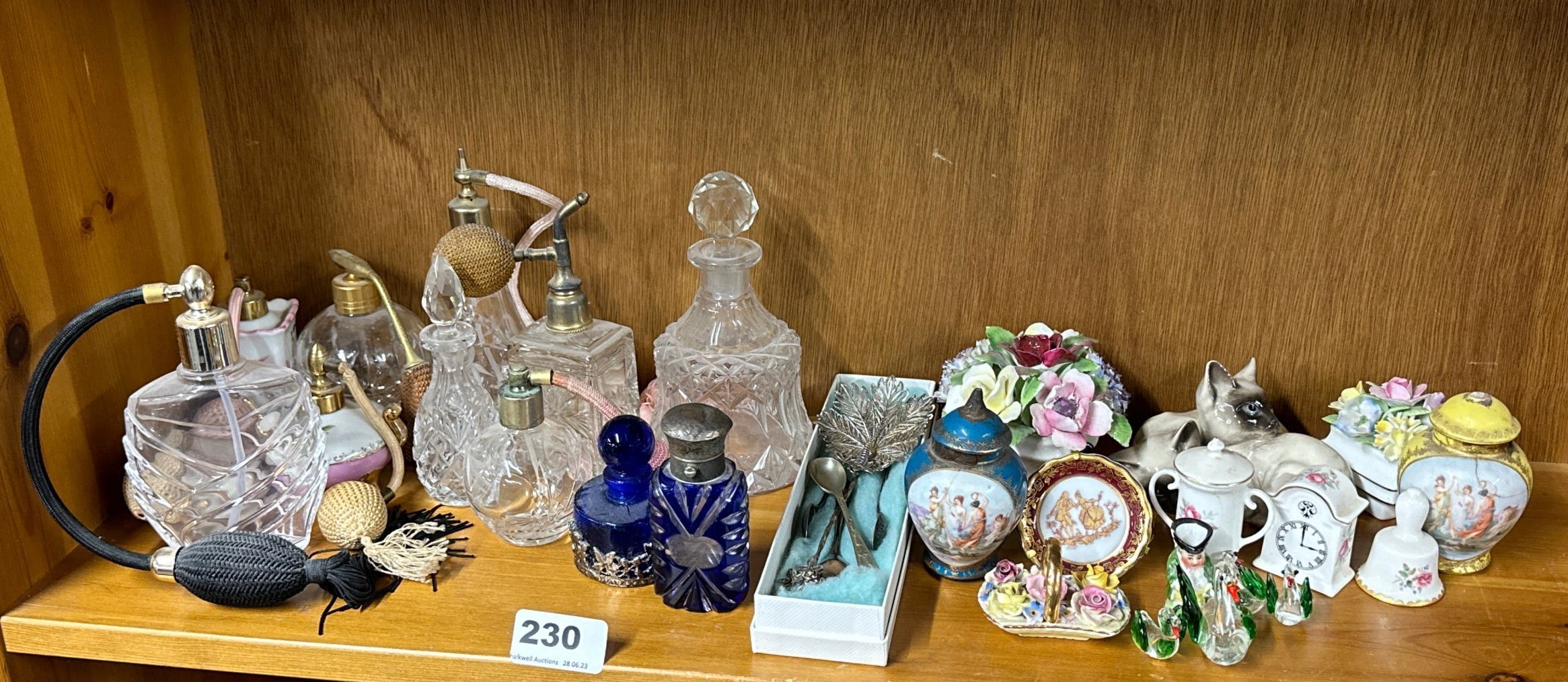 A group of perfume bottles and other small items.
