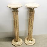 A pair of heavy marble and gilt metal torchere/ plant stands, H. 102cm.