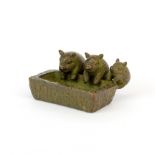 A small Japanese cast bronze model of three piglets at a trough, W. 4.5cm.