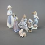 A group of six Nao porcelain figurines, tallest H. 24cm.