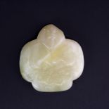 A Chinese carved jade / hardstone amulet of a monkey on a bunch of peaches, W. 8cm.