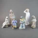 A group of six Nao porcelain figures, tallest 27cm.