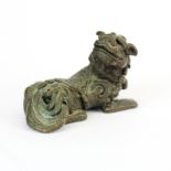 A small Chinese cast bronze model of a lion dog, L. 6cm, H. 3.5cm.