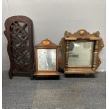 An Edwardian inlaid mahogany wall mirror, H. 50cm. Together with a folding fretwork fire screen