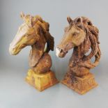 Two cast iron garden horses heads, H. 45cm.