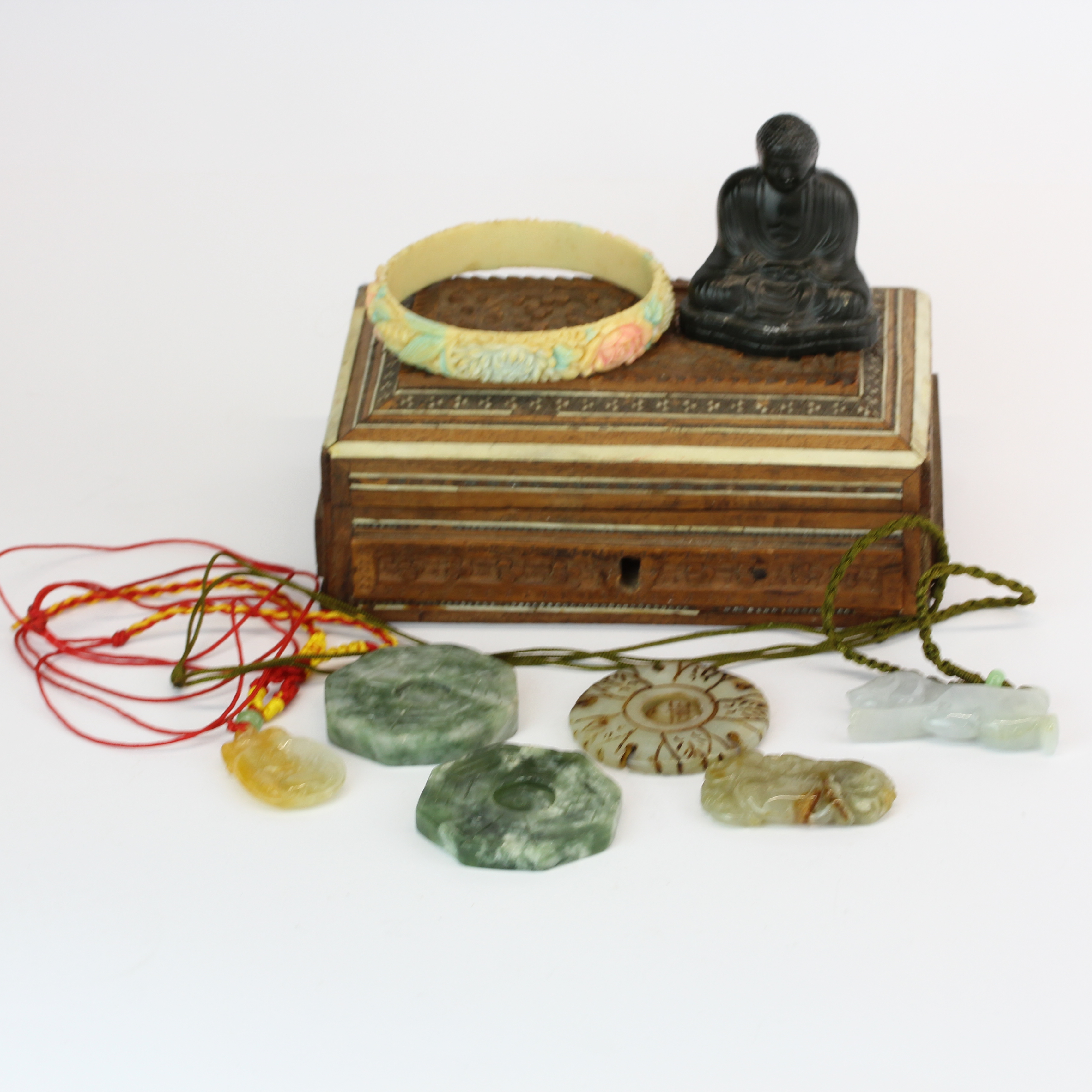 A box of Chinese jade and other items.
