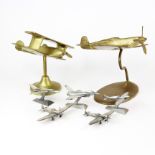 A group of mixed metal airplane models, largest H. 18cm.