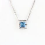 A large 18ct white gold pendant set with fancy cut Swiss tanzanite surrounded by diamonds, 1 x 4 x