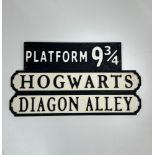 Three wooden Harry Potter signs, largest L. 78cm.